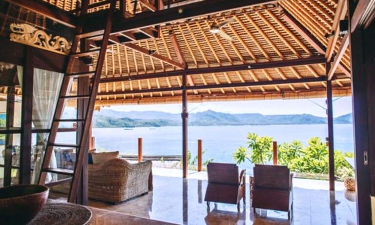 inside of villa with chairs and ladder