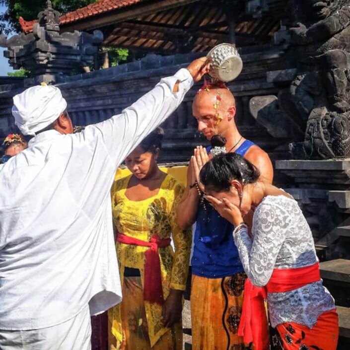 people in water blessing ceremony
