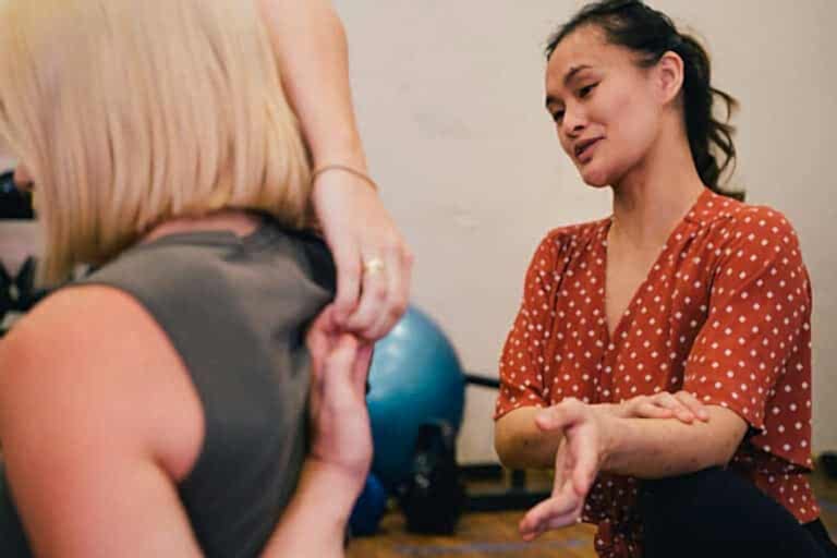 a physio instructs a patient during a session